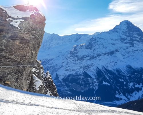 Winter activities in Grindelwald, First Cliff Walk by Tissot seen in a snow covered landscape