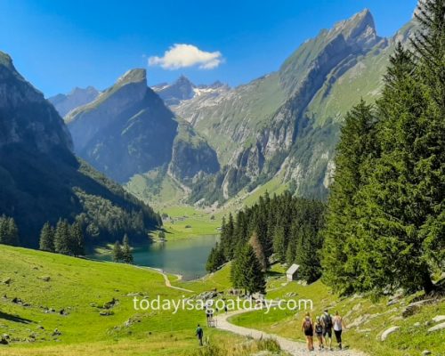 One of the best things to do in Appenzell. group f people hiking towards the Seealpsee