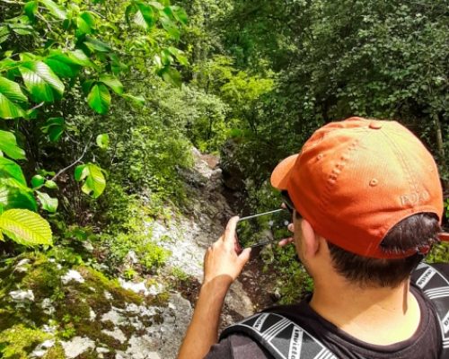 Hiking in Aargau, man capturing the path with a mobile phone