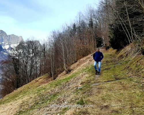 Hiking in Galrus, final part of the roman trail man descending to Mühlehorn on grass covered route