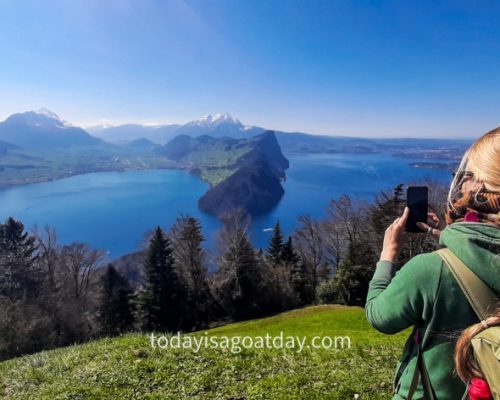 Sophia taking photographs of the view of Lake Lucerne