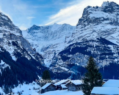 Winter activities in Grindelwald, blue hour in Grindelwald village, snow covered mountains