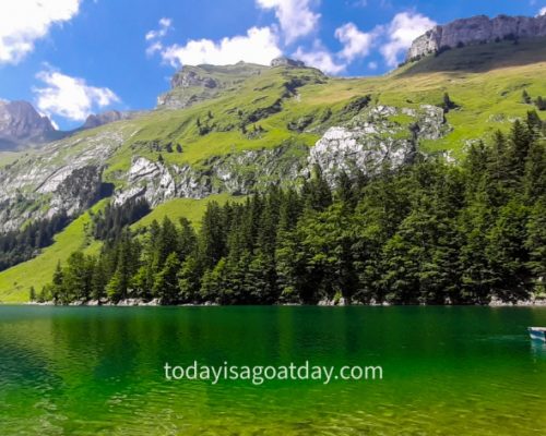 One of the best things to do in Appenzell, crystal-clear Seealpsee with an ice cream boat