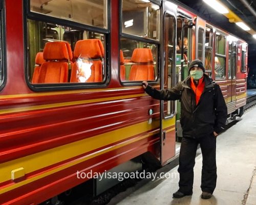 Top attraction in Switzerland, Krisztian standing beside the famous Jungfrau railway