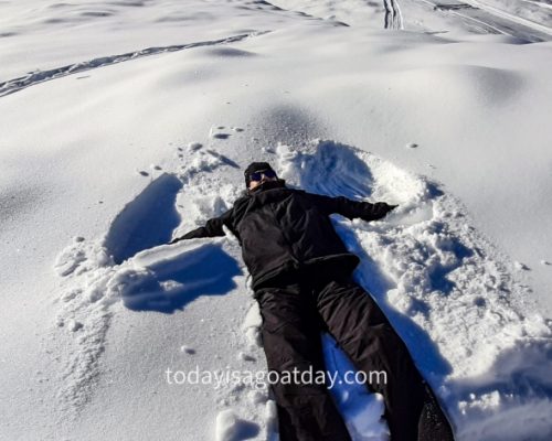 Winter hiking in Grindelwald, Krisztian making a snow angel