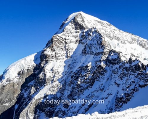 Top attraction in Switzerland, Mönch mountain peak seen from Jungfraujoch