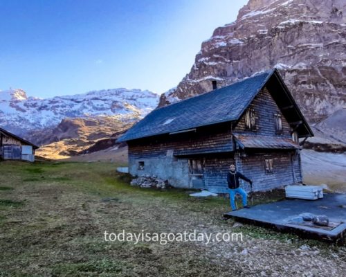 Hiking trails in Engelberg, mountain hut and light coming up in the background