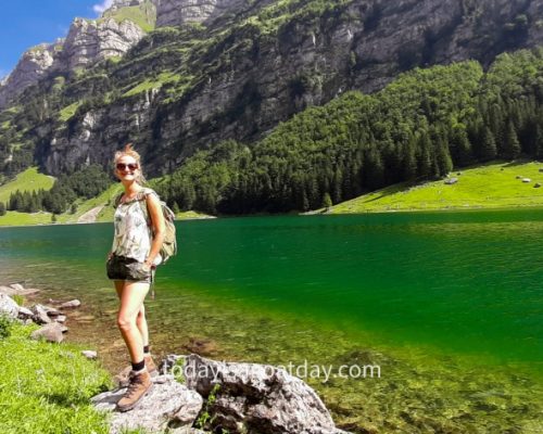 One of the best things to do in Appenzell, girl standing on the lake shore posing for a icture