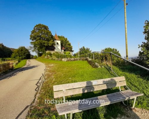 Hiking in BIel, couple taking a picture of their shadow on a bench