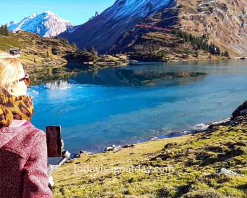 Hiking trails in Engelberg, woman admiring Trübsee lake