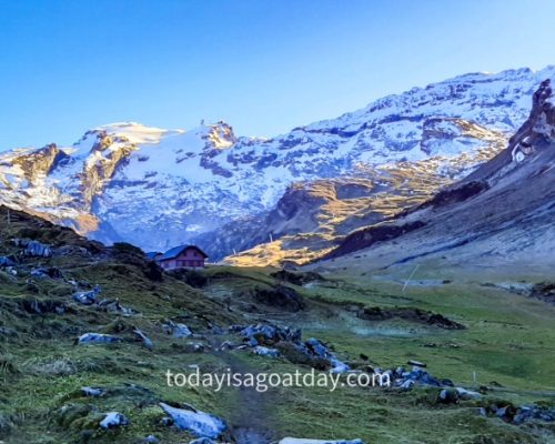 Hiking trails in Engelberg, light at the back of the mountains can be seen from mountain path