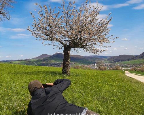 Hiking in canton Aargau,, Krisztian lying on the ground taking a picture