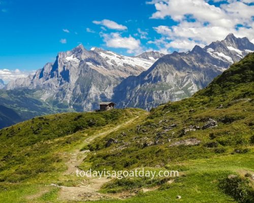 Top hike from Grindelwald , trail to a mountain hut surrounded by the Grindelwald mountain panorama